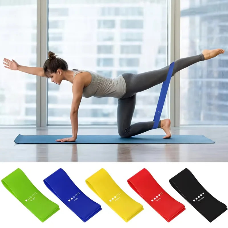 Woman using Resistance Bands 5 Levels for workout on yoga mat with colorful bands in foreground.